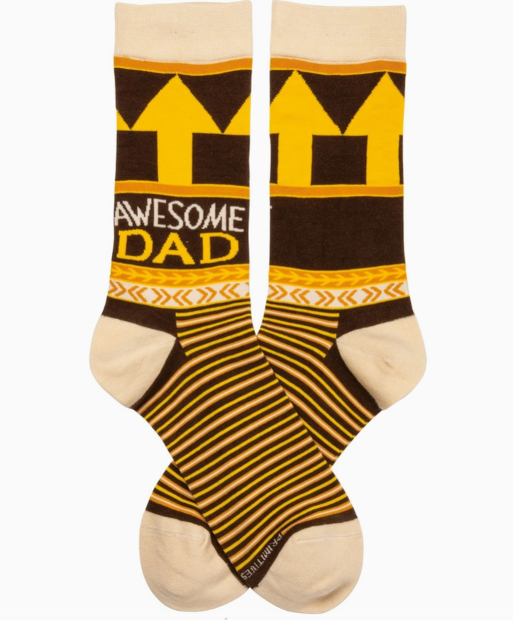 Brown and yellow striped novelty socks featuring phrase "awesome dad" and arrows pointing up, on a white background.