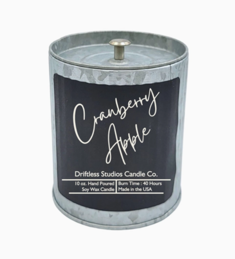 Cranberry Apple scented candle in a tin container with lid on a white background.