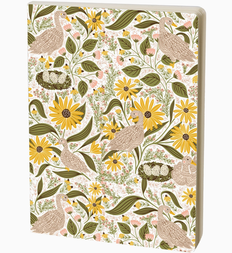 A notebook featuring a detailed William Morris-style floral and bird pattern with yellow flowers, green leaves, and brown birds on an off-white background.