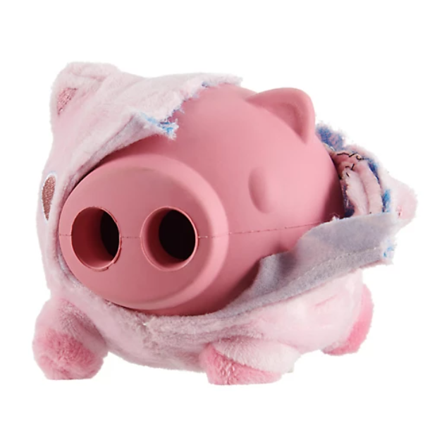 Pink plush toy pig with the outer layer torn to reveal rubber core on a white background