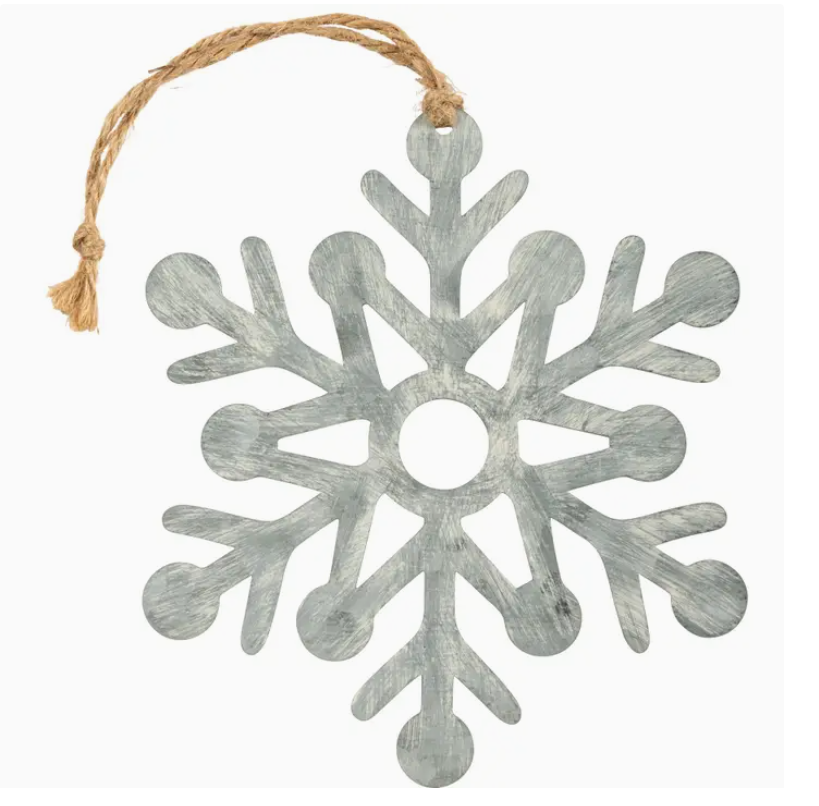 Decorative snowflake ornament with a rustic finish on a white background