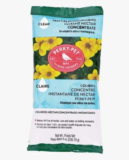 Perky-Pet hummingbird instant nectar concentrate package with flowers on a white background