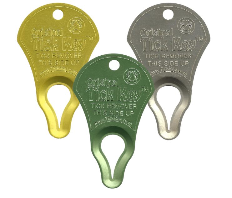 Three 'Original Tick Key' tick removers in yellow, green, and gray on a white background.
