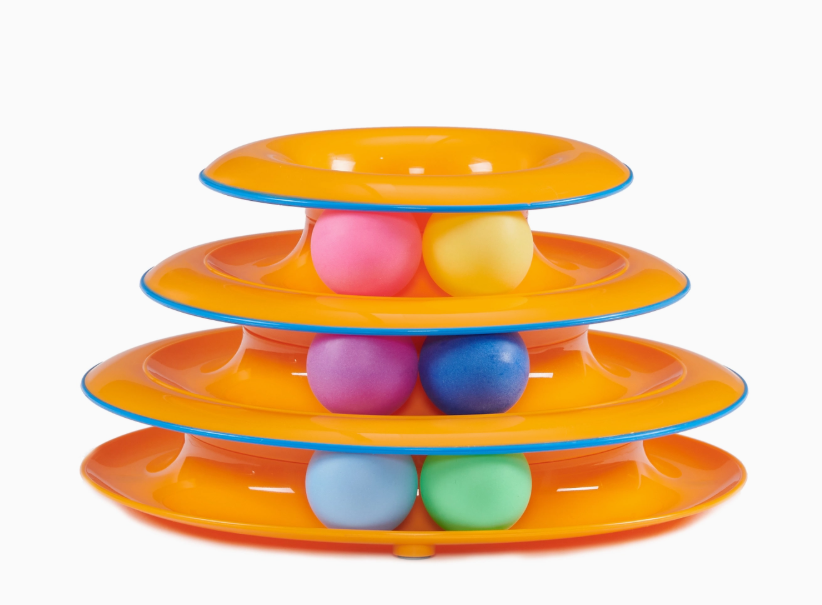 Colorful tiered toy with plastic balls on a white background