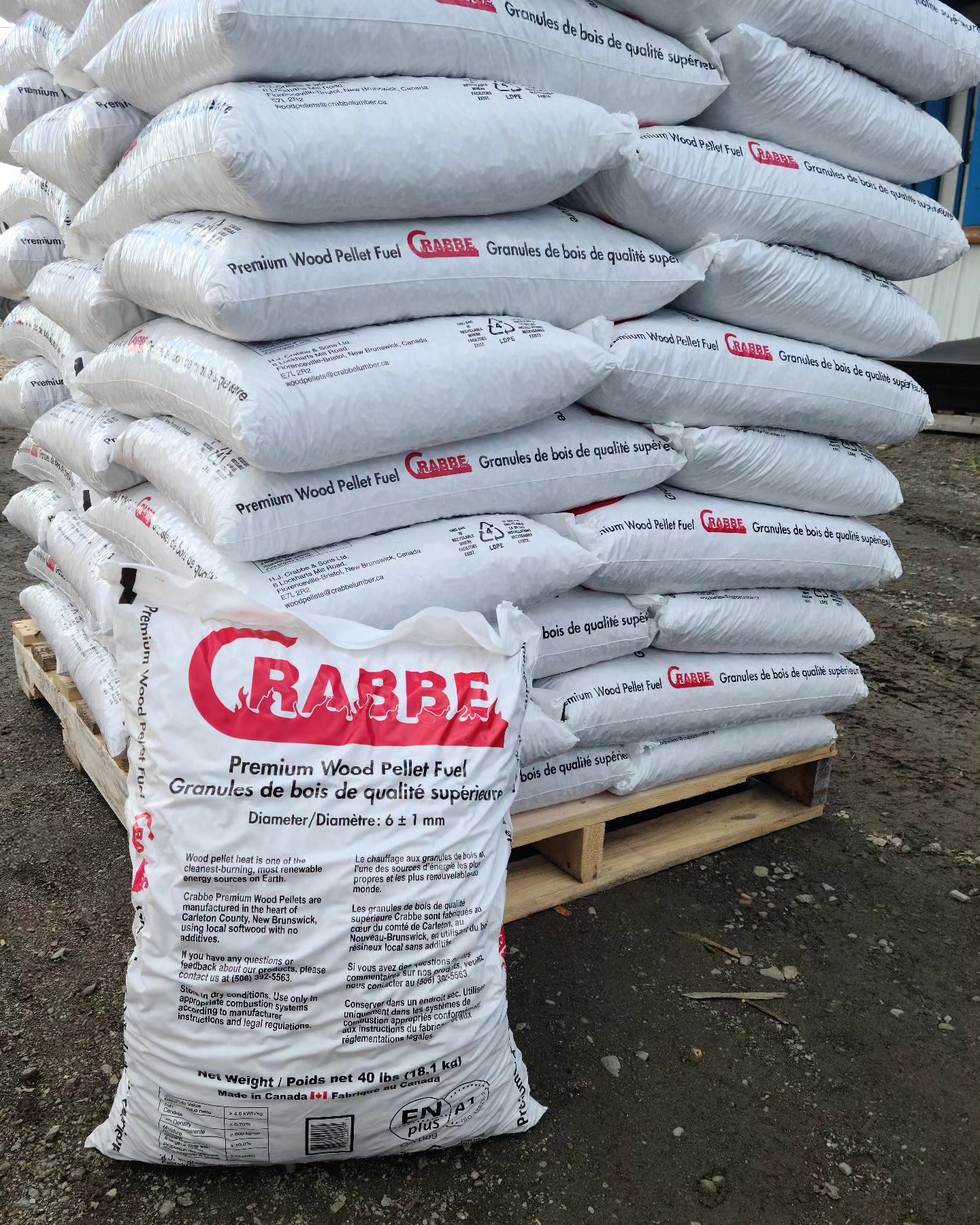 Stack of Crabbe wood pellet fuel bags on a pallet