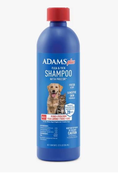 Blue bottle of Adams Plus flea and tick shampoo with red cap on a white background