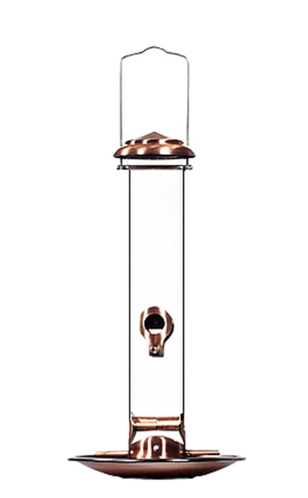Copper bird feeder with glass container on a white background