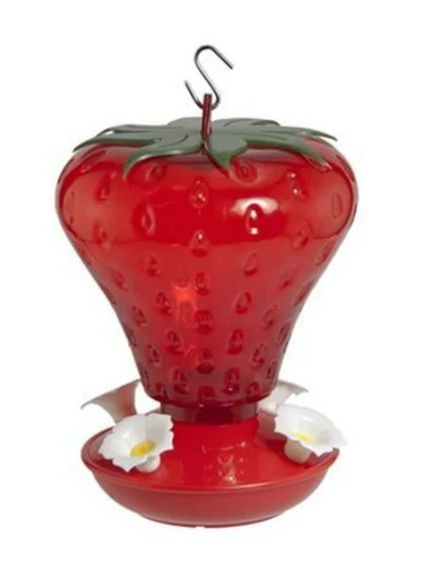 Red strawberry-shaped hummingbird feeder with white flowers on a white background