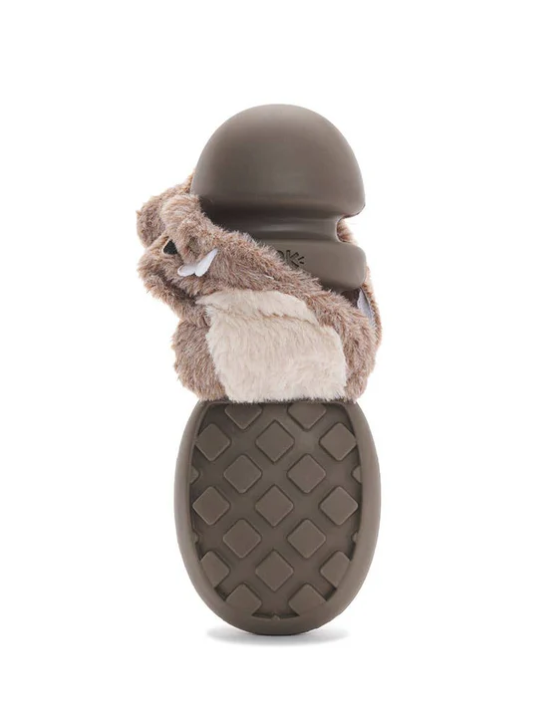 Brown beaver-shaped dog toy with the plush layer torn to reveal the rubber core, on a white background