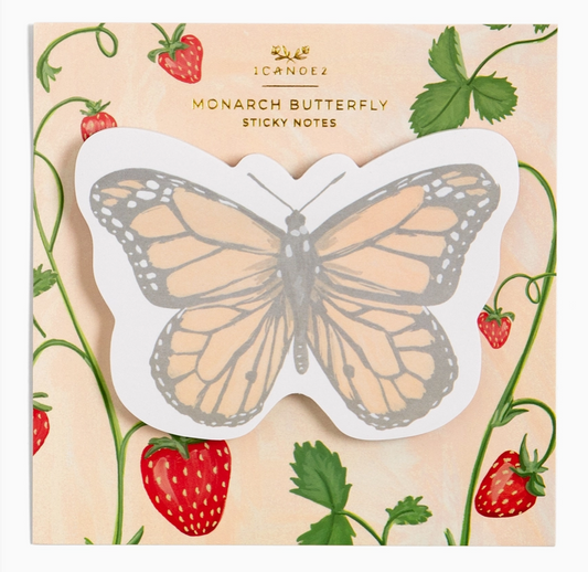 Butterfly-shaped sticky notes featuring a monarch butterfly design in orange, black, and white on a white backing, set against a decorative background with strawberries and green leaves.