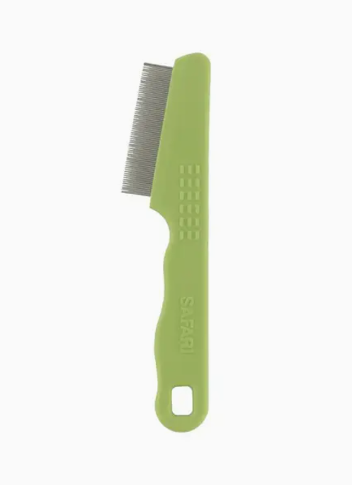 Green comb with metal teeth on a white background