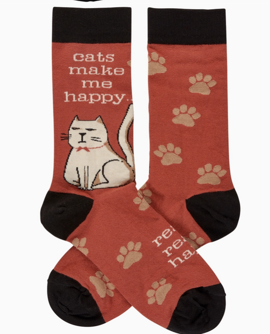 Pair of rust colored novelty socks featuring cat themed design and phrase "cats make me happy .... really, really, happy" on a white background.