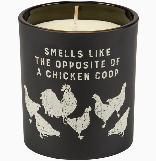 Black candle with chicken coop design and text on a white background