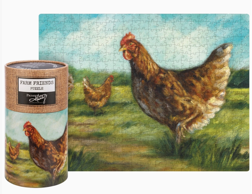 A completed jigsaw puzzle showing a farm scene with brown chickens in a grassy field under a blue sky, displayed next to its cylindrical wrapped storage tube. The tube label reads 'Farm Friends Puzzle' and shows a chicken illustration.