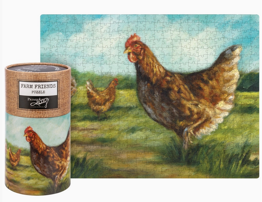 A completed jigsaw puzzle showing a farm scene with brown chickens in a grassy field under a blue sky, displayed next to its cylindrical wrapped storage tube. The tube label reads 'Farm Friends Puzzle' and shows a chicken illustration.