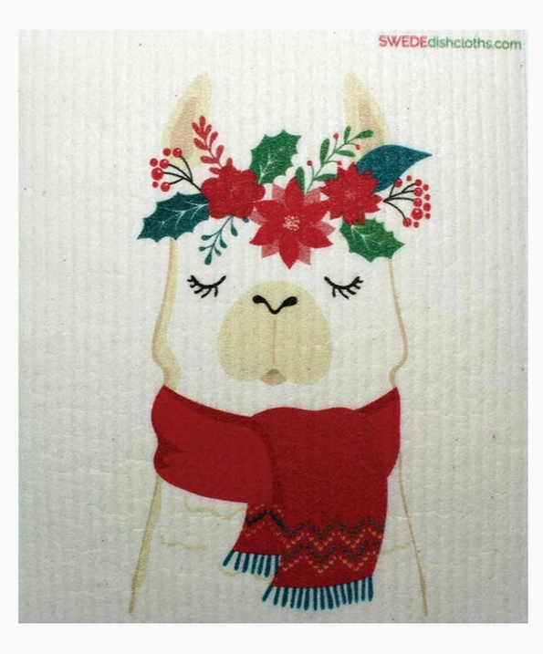 Dishcloth with a llama design wearing a red scarf and floral headband on a white background.