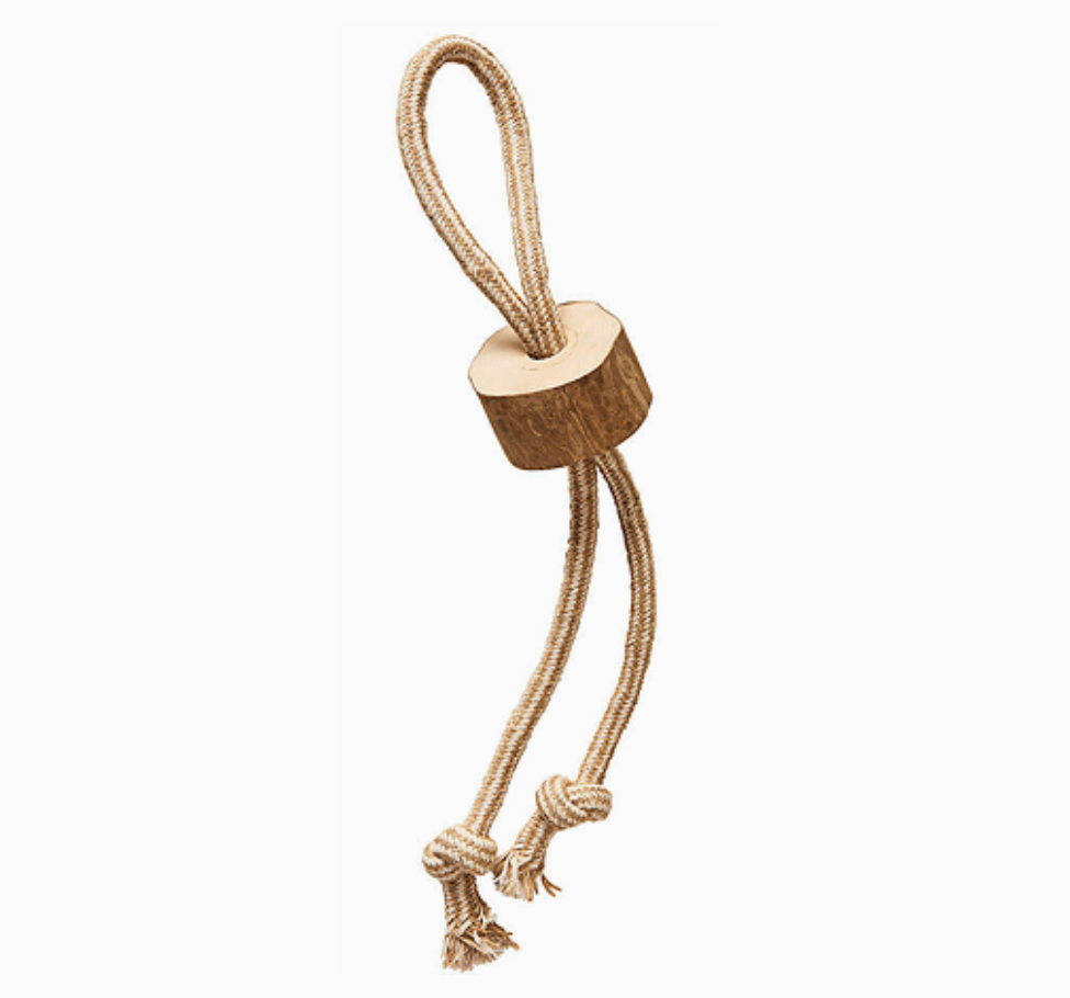 Wooden dog toy with a rope on a white background