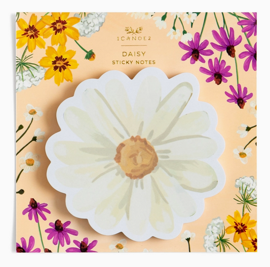 A package of Daisy Sticky Notes, featuring a large die-cut white daisy note in the center, surrounded by a floral border of yellow, purple, and white flowers on a peach background.