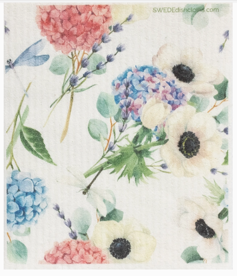 Colorful floral arrangement with hydrangeas, anemones, and other flowers on a white background.