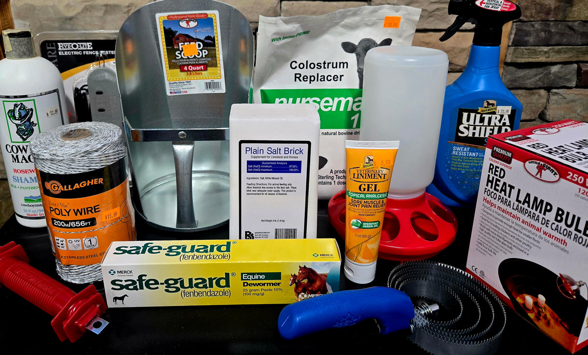 Assorted animal care products including a salt block, gel, and other supplies on a stone surface.
