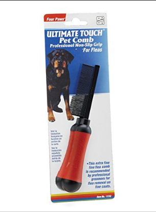 Four Paws Ultimate Touch Pet Comb packaging with a dog illustration on a white background