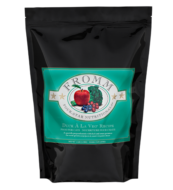 Black pet food package with a green label featuring the 'Fromm' brand on a white background