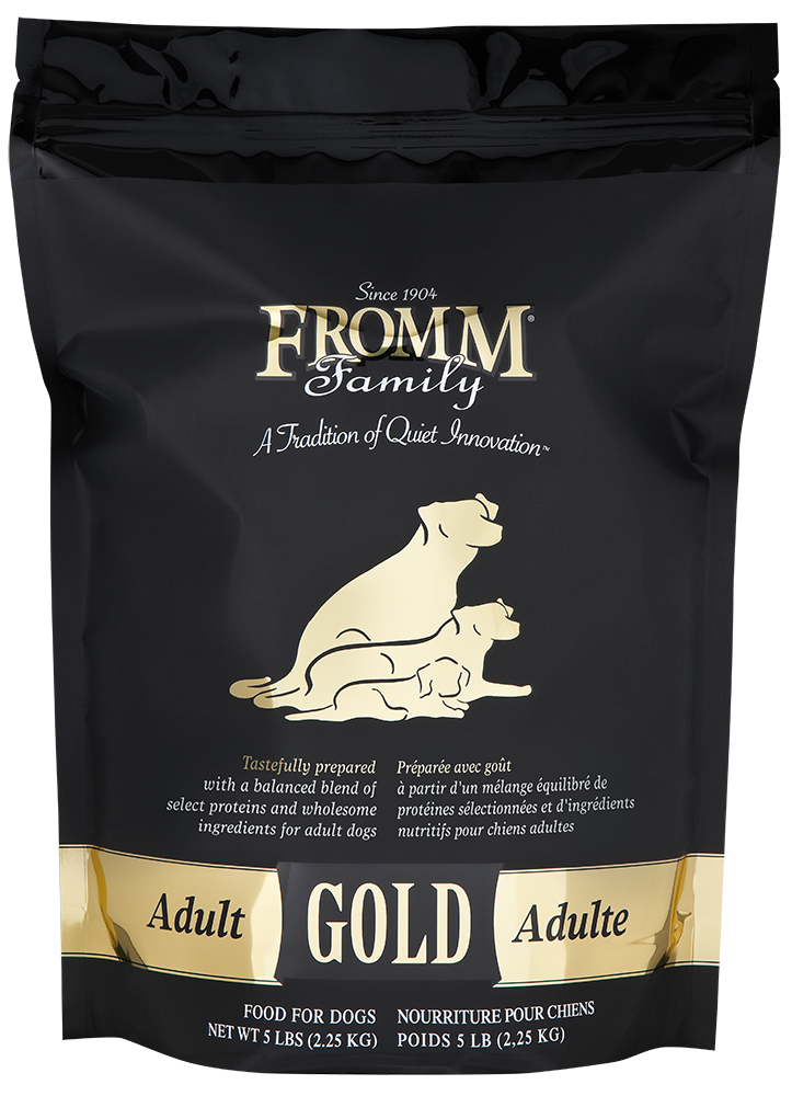 Black bag of Fromm Family Adult Gold dog food with gold text and illustrations.