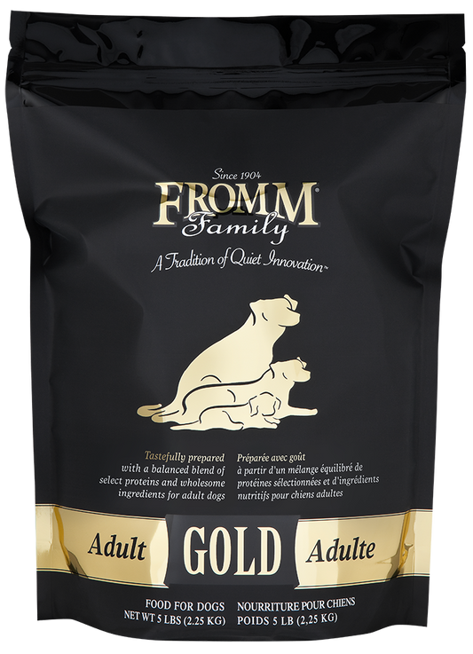 Black bag of Fromm Family Adult Gold dog food with gold text and illustrations.