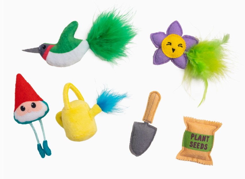 Set of colorful garden-themed cat toys on a white background