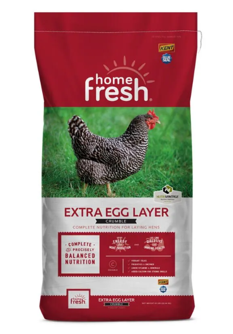 Home Fresh Extra Egg Layer chicken feed packaging with a chicken on a grassy background