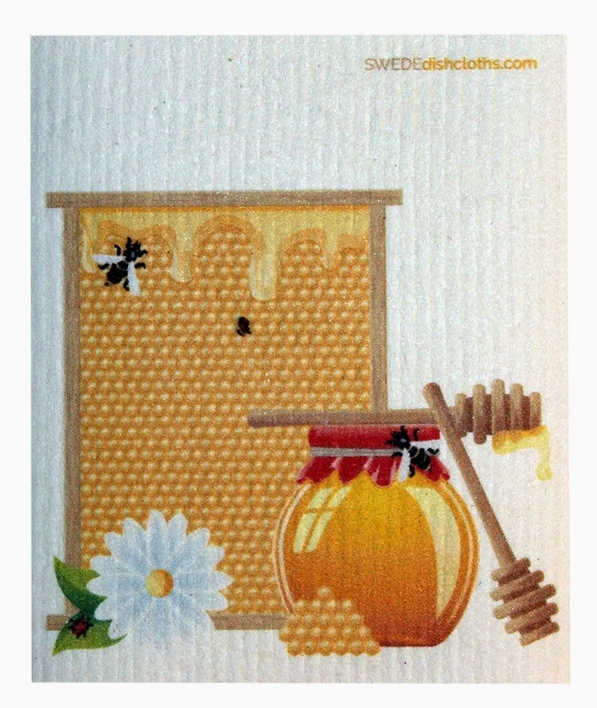 Swedish dishcloth with honeycomb, jar of honey, and honey dipper design.