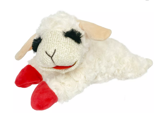 White plush toy sheep with red feet on a white background