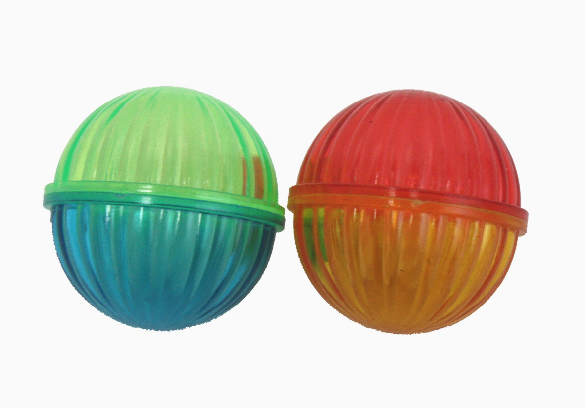 Two colorful plastic balls on a white background