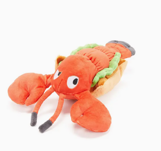 Plush lobster roll shaped dog toy on a white background.