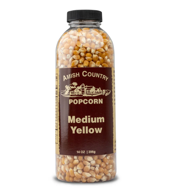Amish Country Popcorn container with medium yellow popcorn on a white background