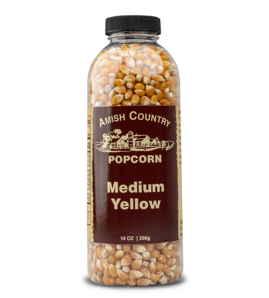 Amish Country Popcorn container with medium yellow popcorn on a white background