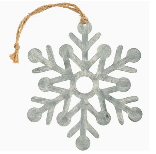 Decorative snowflake ornament with a rustic finish on a white background