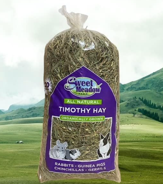 Bag of Sweet Meadow Timothy Hay with a scenic background