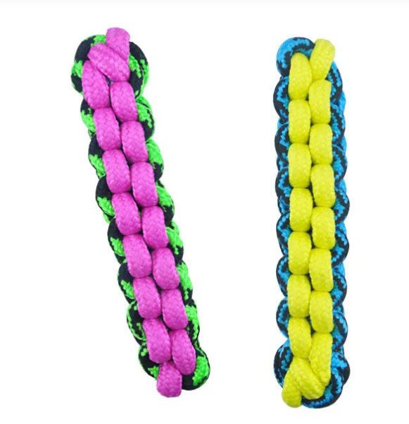 Dog toy with braided pink and green rope and knotted blue and yellow rope on a white background