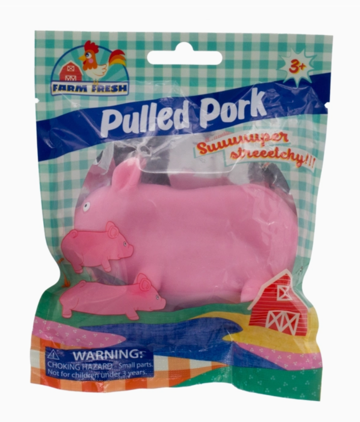 Pink toy pig in a colorful packaging with 'Farm Fresh' branding