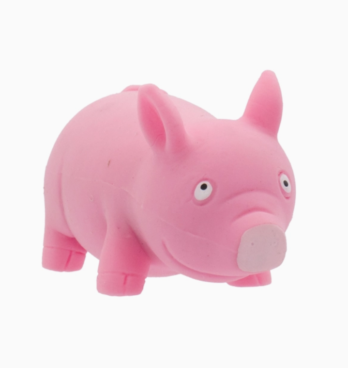 Pink pig stretchy sand toy on a white background.