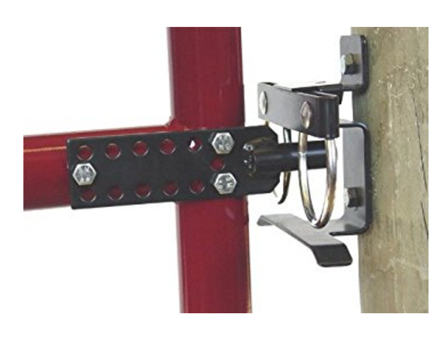 Metal bracket attached to a red metal frame and wooden post