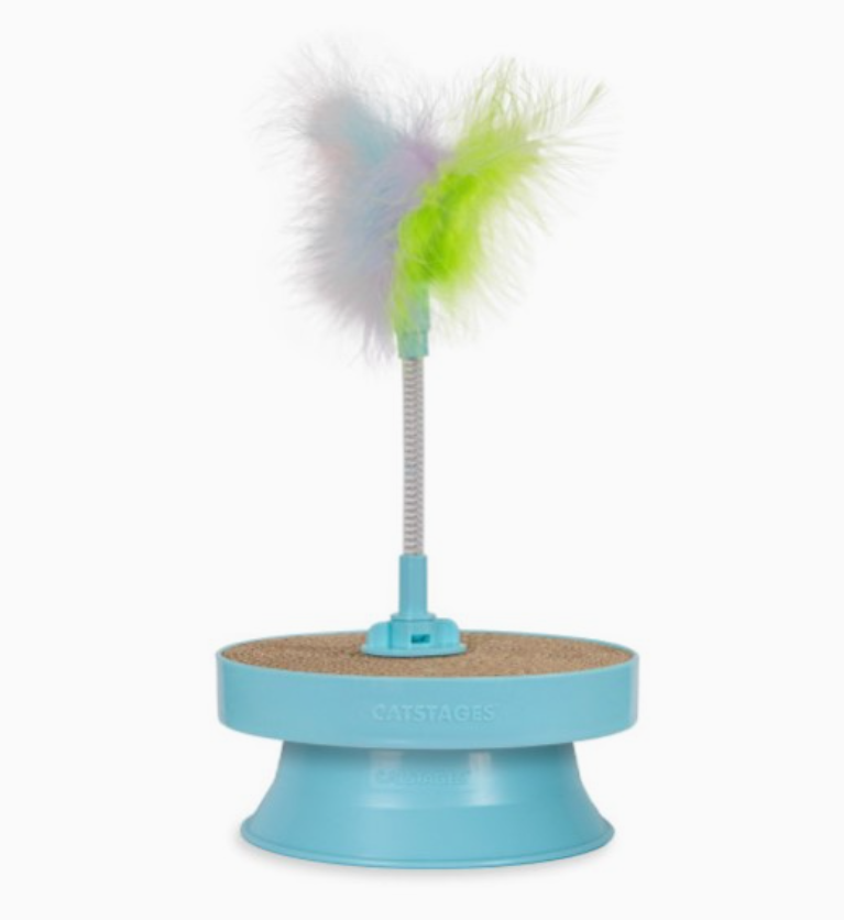 Blue cat toy with feather on a white background