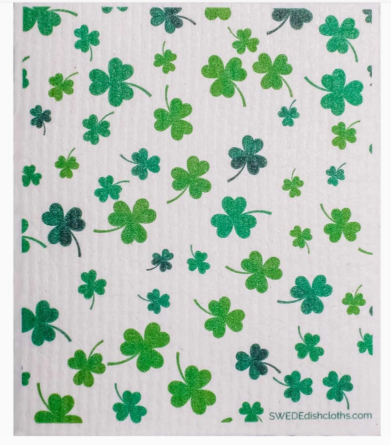 White cloth with green shamrock pattern, branded 'SWEDEdishclths'.