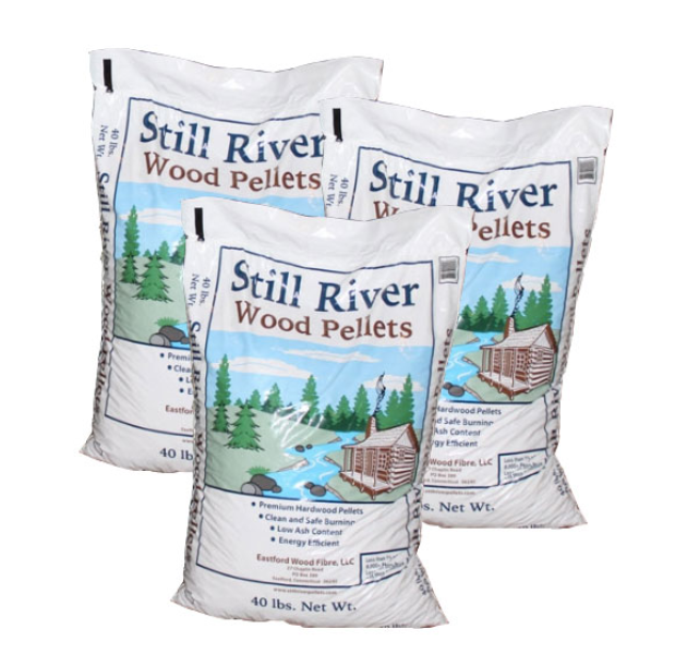 Three bags of Still River Wood Pellets on a white background