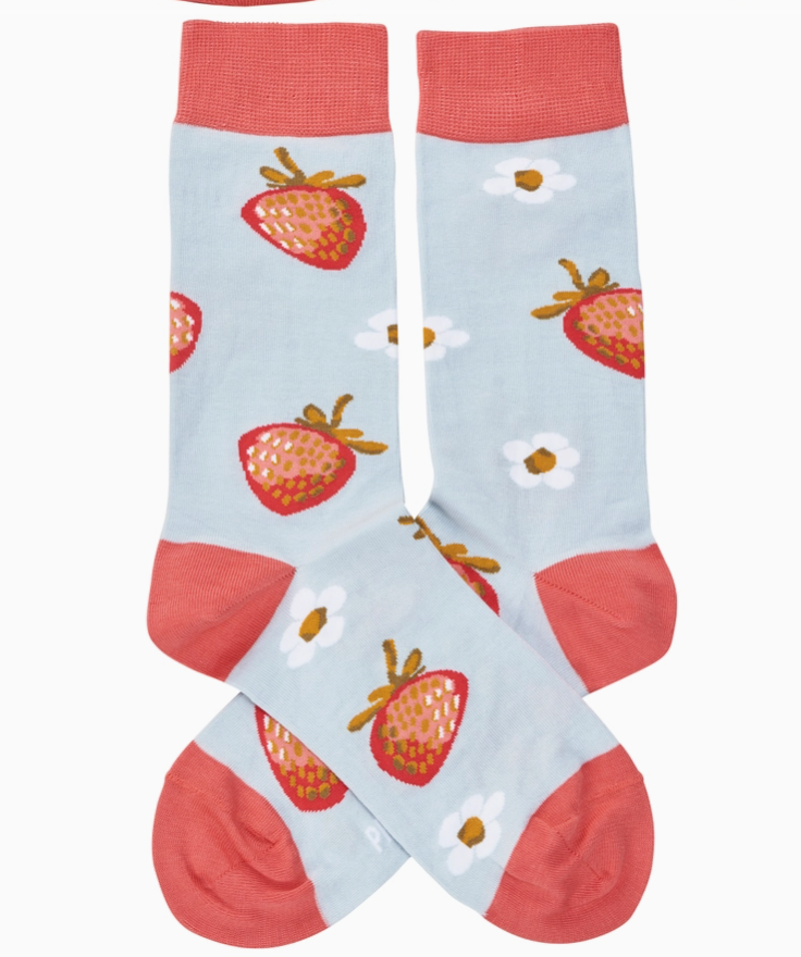Pair of light blue and pink socks with images of strawberries and flowers on a white backgound.