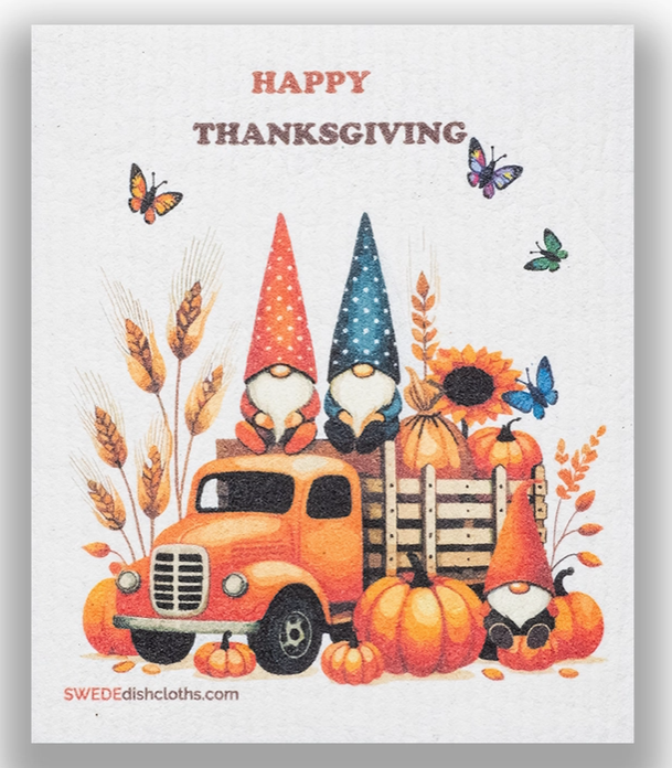 Thanksgiving-themed card with gnomes, a truck, and pumpkins on a light gray background.