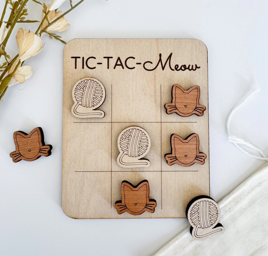 Cat themed tic tac toe board on a white background.