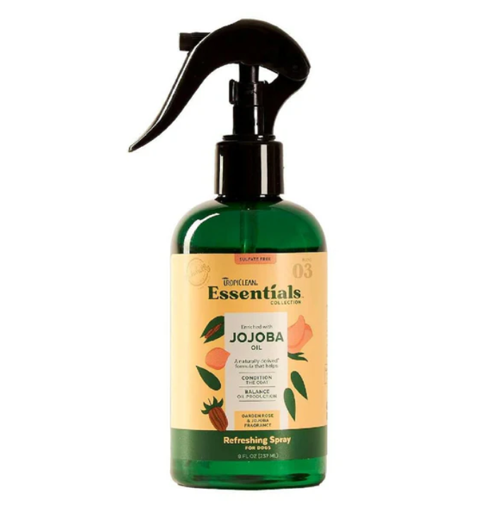 Bottle of Jojoba oil spray with a label on a white background