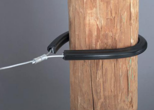 Tubular Corner & end post insulator around a wood post on a gray background.